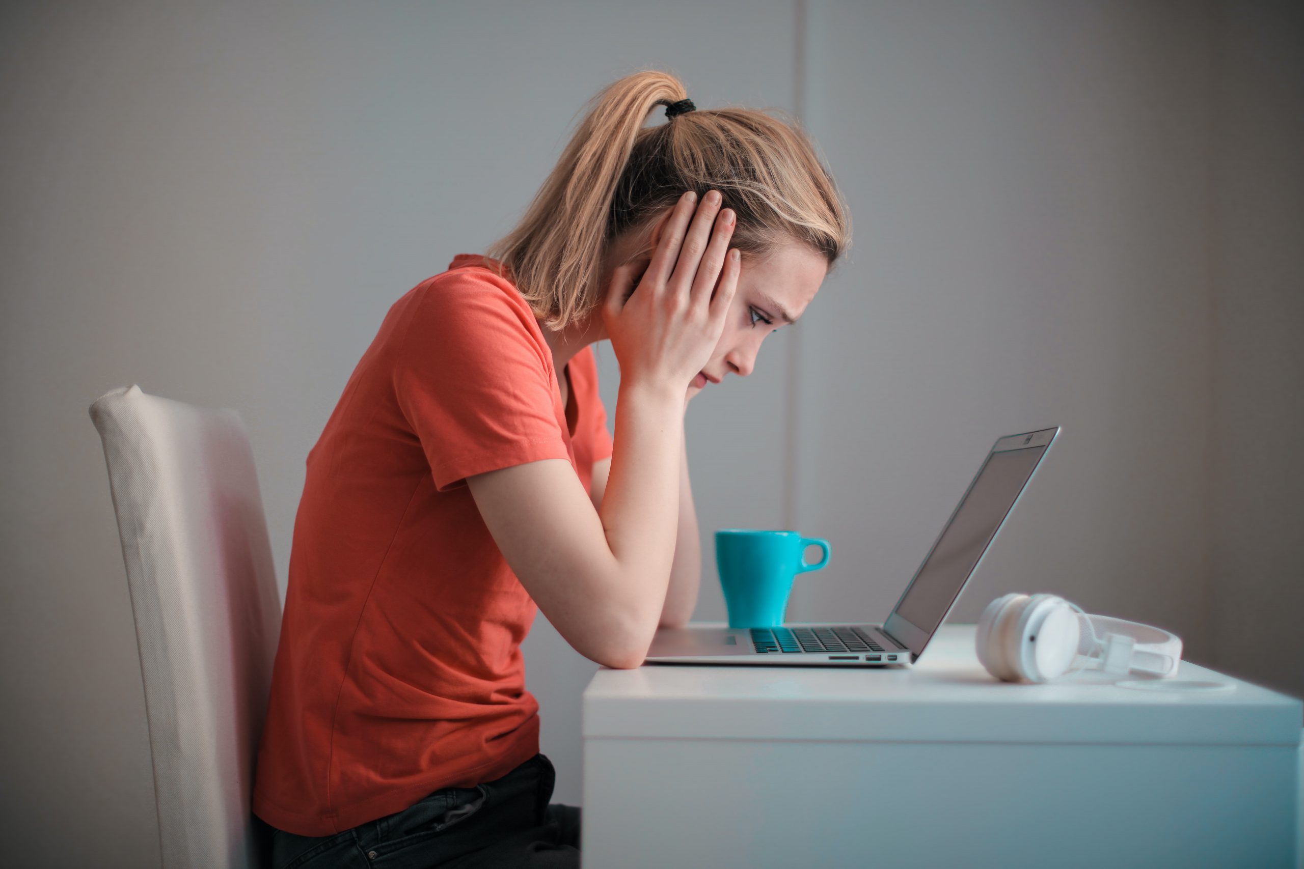 young-troubled-woman-using-laptop-at-home-3755755